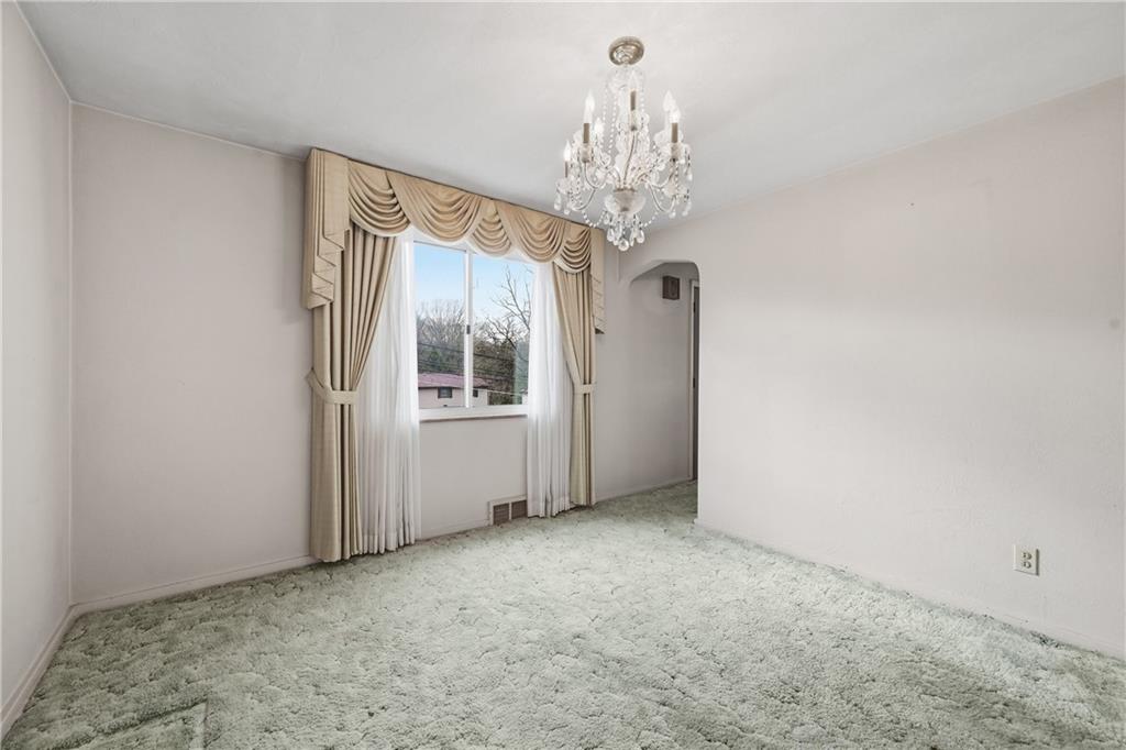 824 Vilsack Road Glenshaw, PA 15116 - Photo 22 of 44 a view of a big room with windows and chandelier
