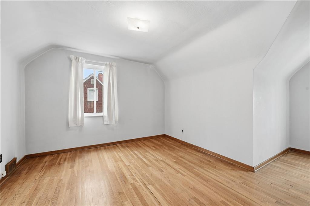 824 Vilsack Road Glenshaw, PA 15116 - Photo 27 of 44 an empty room with wooden floor and windows