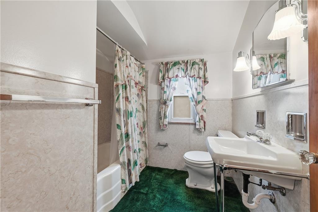 824 Vilsack Road Glenshaw, PA 15116 - Photo 32 of 44 a bathroom with a sink a toilet and shower curtain