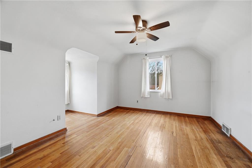 824 Vilsack Road Glenshaw, PA 15116 - Photo 33 of 44 a view of empty room with wooden floor and fan