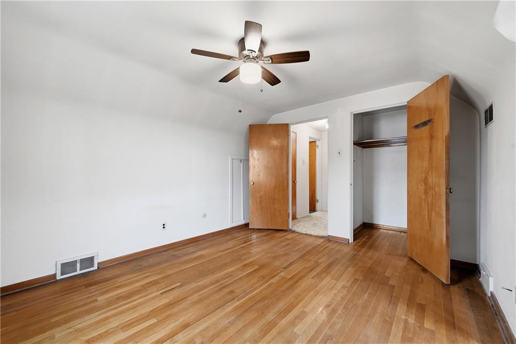 824 Vilsack Road Glenshaw, PA 15116 - Photo 35 of 44 a view of a livingroom with wooden floor and a ceiling fan