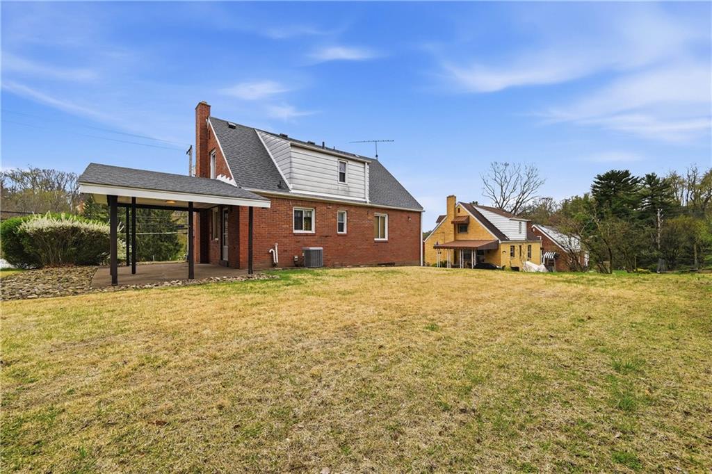 824 Vilsack Road Glenshaw, PA 15116 - Photo 42 of 44 a front view of a house with a yard and garage