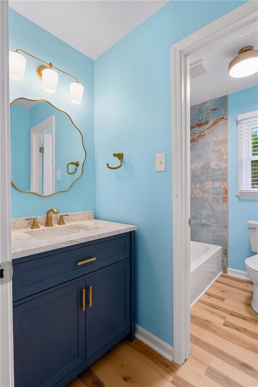 1745 Rockbridge Road Northwest Conyers, GA 30012 - Photo 17 of 32 a bathroom with a sink and a mirror