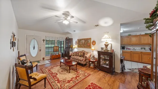 a living room with fireplace furniture and a flat screen tv