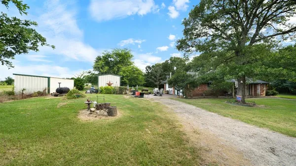 a front view of a house with garden and porch
