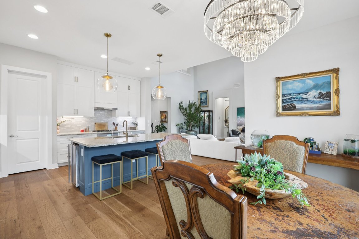 101 Cascading Water Place Austin, TX 78734 - Photo 13 of 36 a living room with furniture and a chandelier