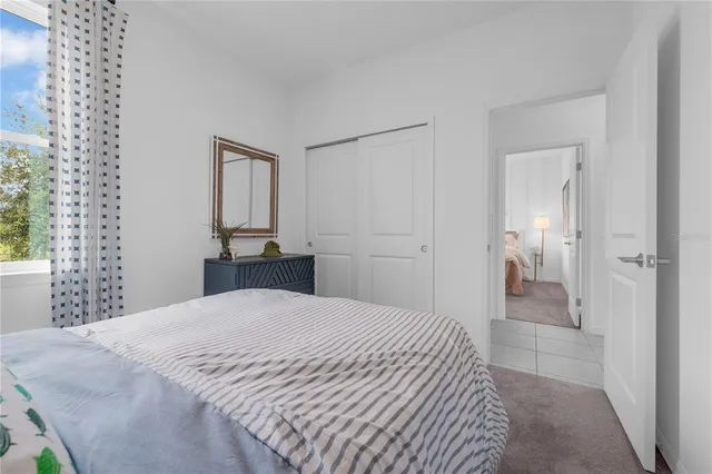 a bedroom with a bed and a cabinets