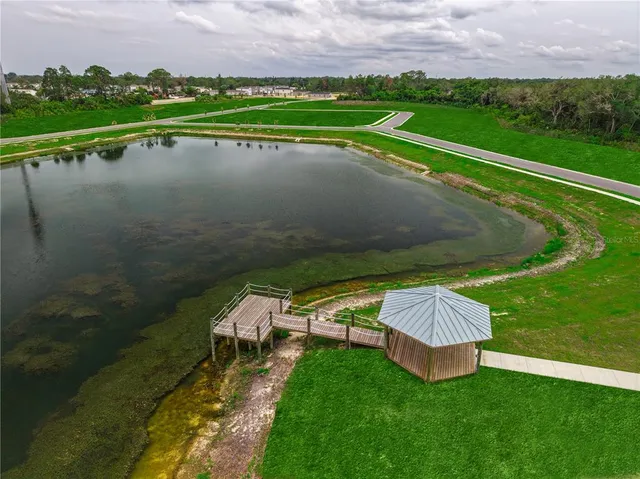 a view of a lake with a big yard