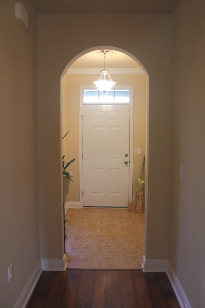511 Pheasant Trail Crestview, FL 32536 - Photo 3 of 50 an empty room with wooden floor and windows