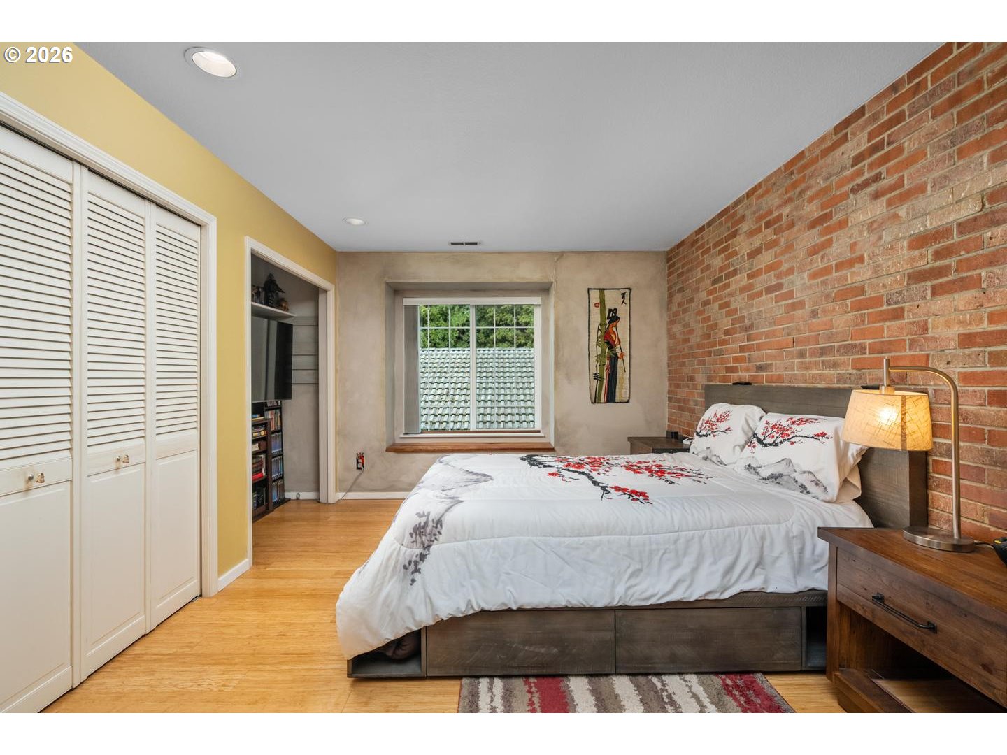 1840 Rees Hill Road Southeast, Unit 19 Salem, OR 97306 - Photo 14 of 34 a bedroom with a bed and wooden floor
