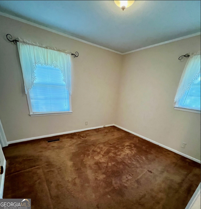 415 Riddleville Road Sandersville, GA 31082 - Photo 14 of 19 an empty room with a window