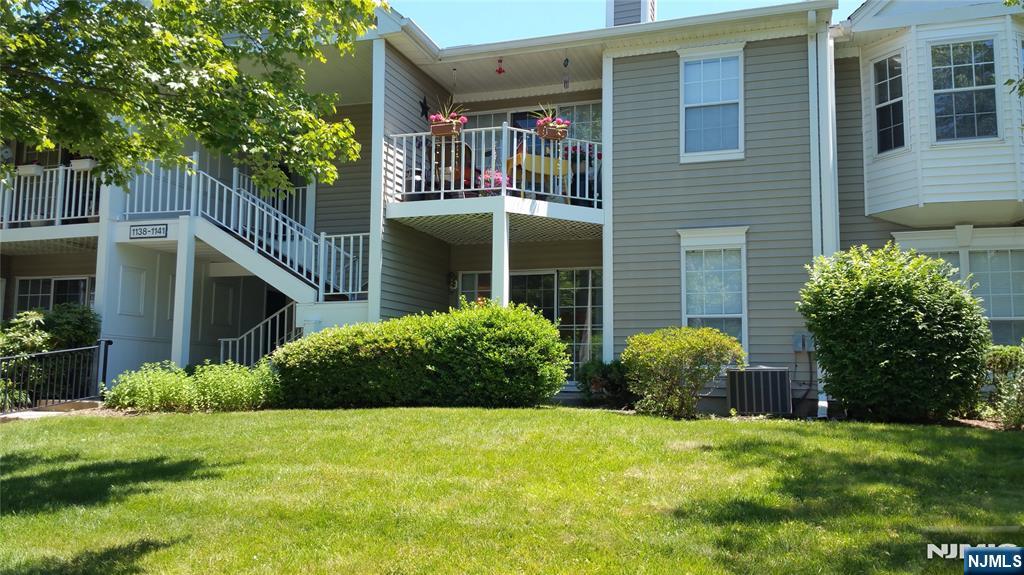 1138 Sycamore Lane Mahwah, NJ 07430 - Photo 1 of 12 a front view of a house with garden