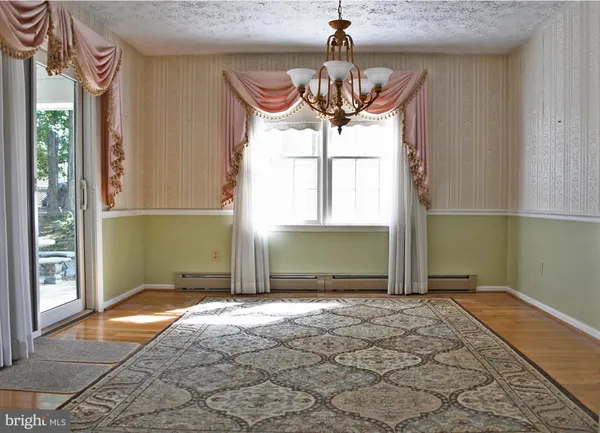 a view of a room with a chandelier