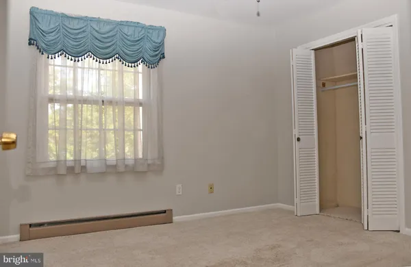 a view of a door and a window in the room