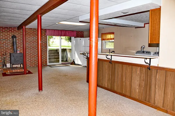 a view of a porch with a table and chairs