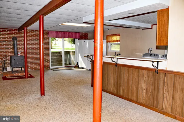 a view of a porch with a table and chairs