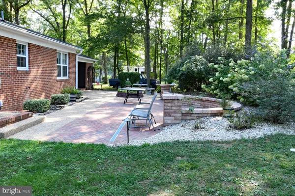 a view of a backyard with sitting area