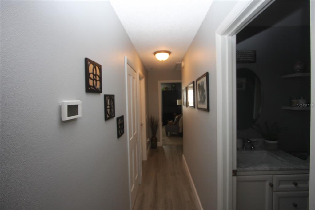810 Loch Calder, Unit 25 Apopka, FL 32712 - Photo 11 of 24 a view of a hallway with a room