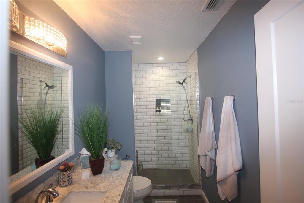 810 Loch Calder, Unit 25 Apopka, FL 32712 - Photo 14 of 24 a bathroom with a shower
