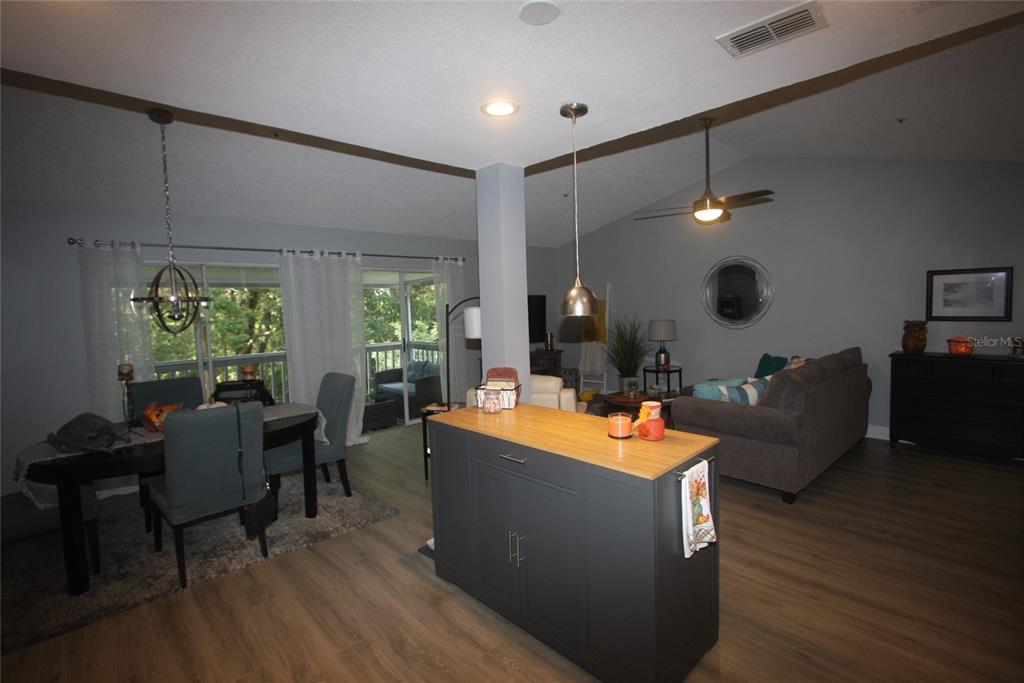 810 Loch Calder, Unit 25 Apopka, FL 32712 - Photo 5 of 24 a living room with furniture and a large window