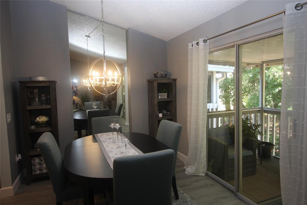 810 Loch Calder, Unit 25 Apopka, FL 32712 - Photo 9 of 24 a view of a dining room with furniture window and outside view