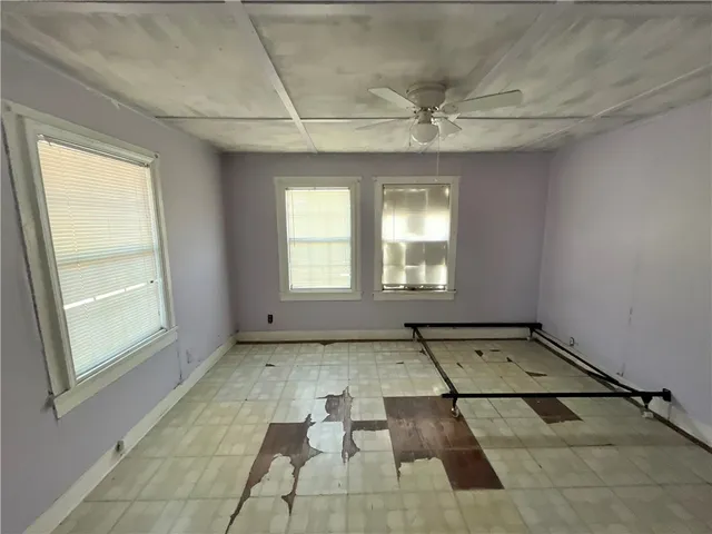 a view of a entryway door with wooden floor and stairs