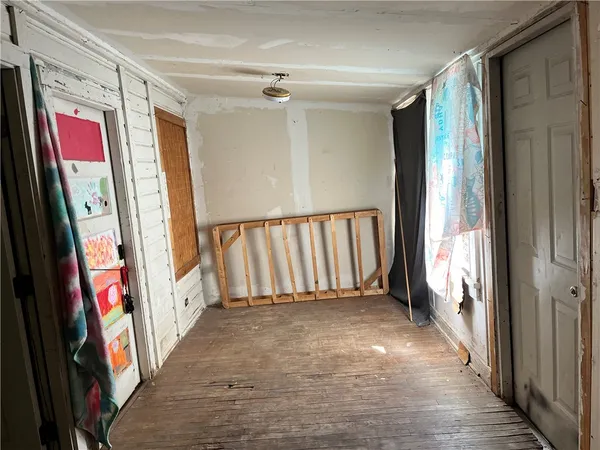 a view of a hallway with storage and utility room