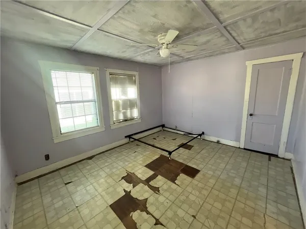 a view of a bedroom with a balcony