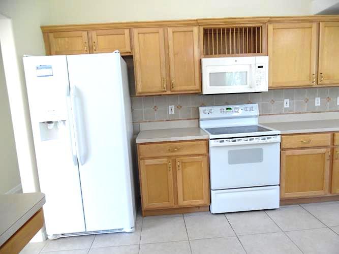 3292 Southeast W Snow Road Port St. Lucie, FL 34984 - Photo 6 of 27 Stove Fridge