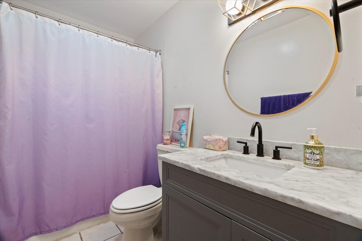3507 Atlantic Avenue Gurnee, IL 60031 - Photo 16 of 33 a bathroom with a granite countertop sink mirror vanity and toilet