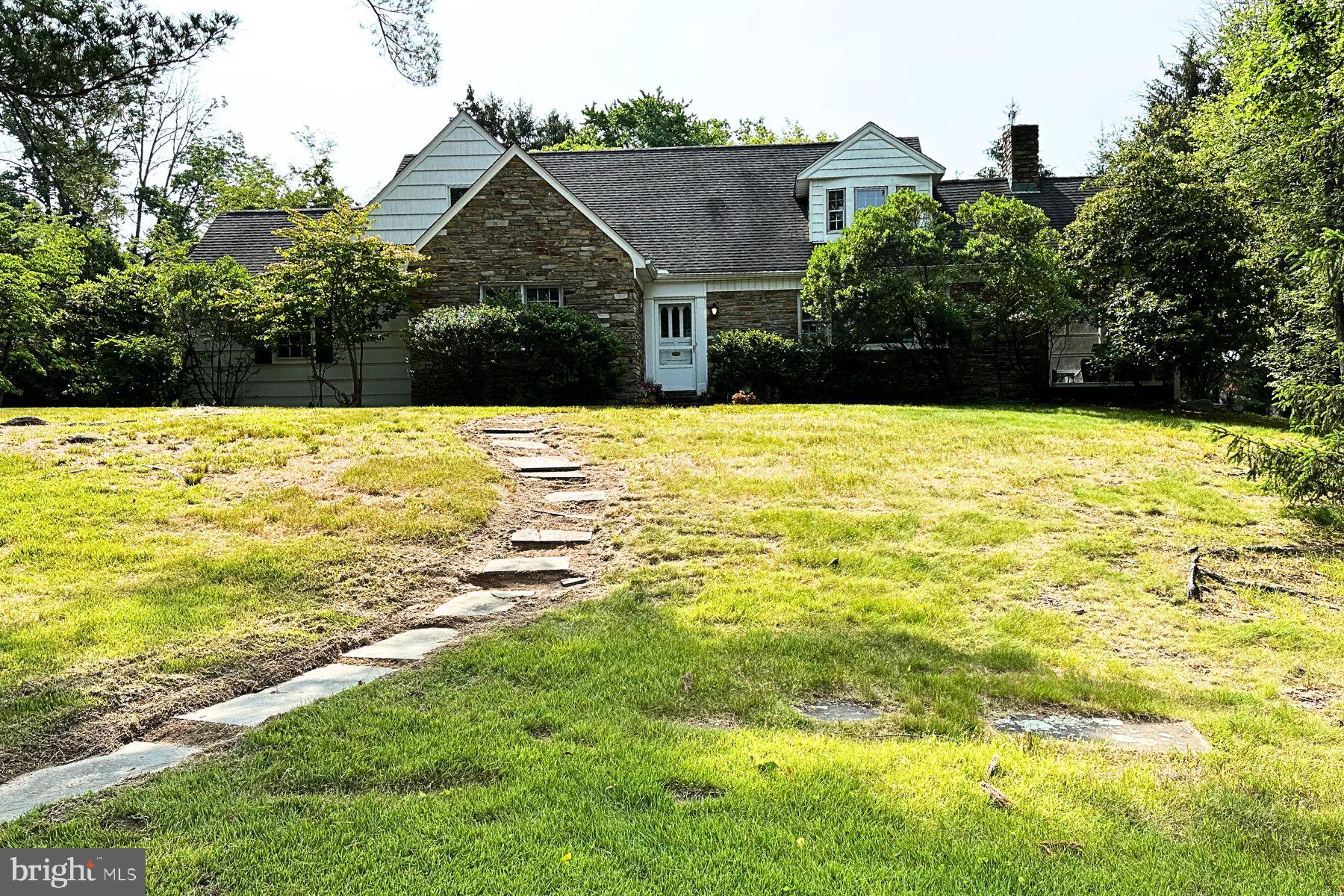 a view of an swimming pool and trees in the background