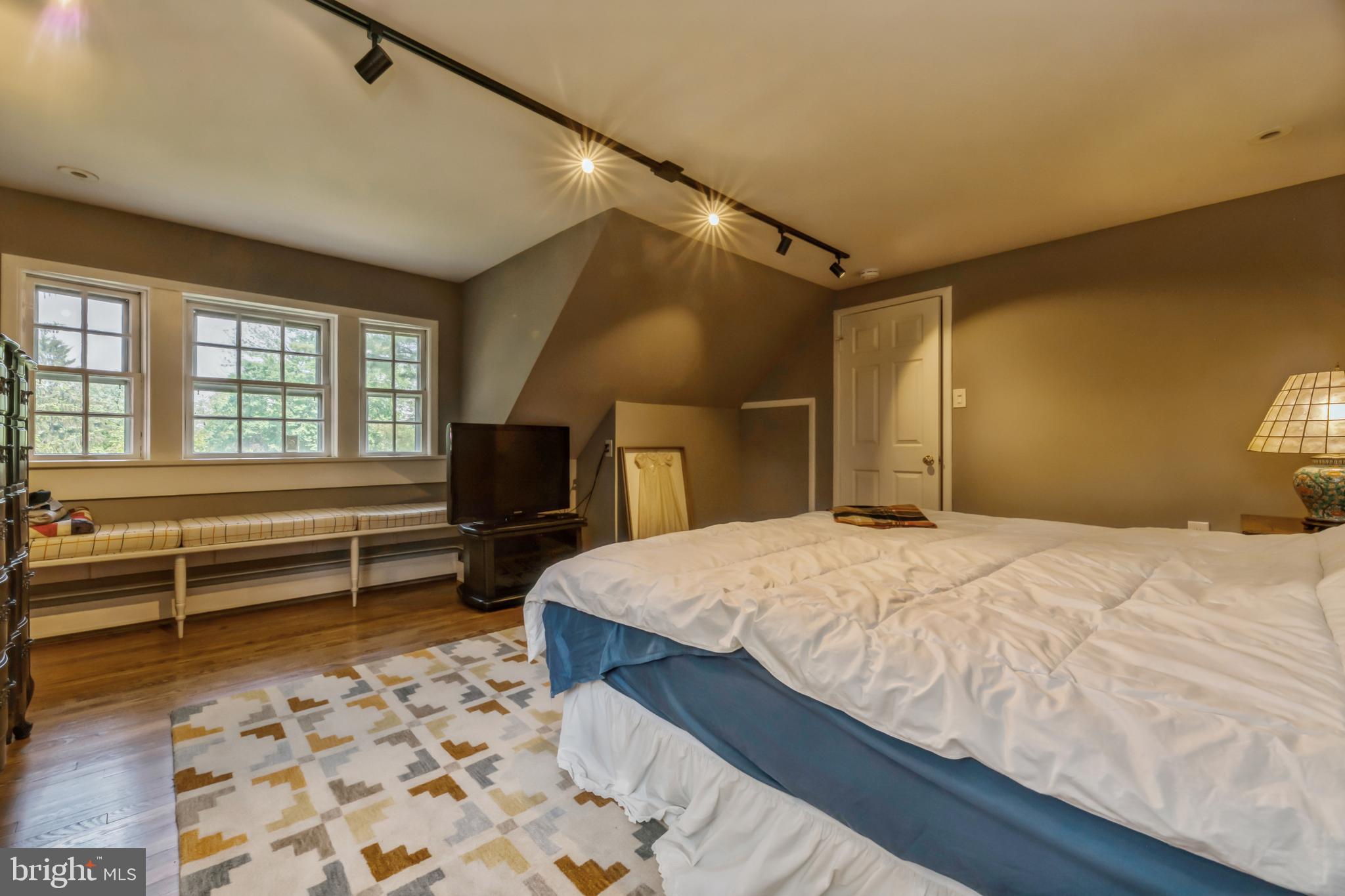 7 Perry Drive Ewing, NJ 08628 - Photo 26 of 39 a bedroom with a bed and a dresser with wooden floor