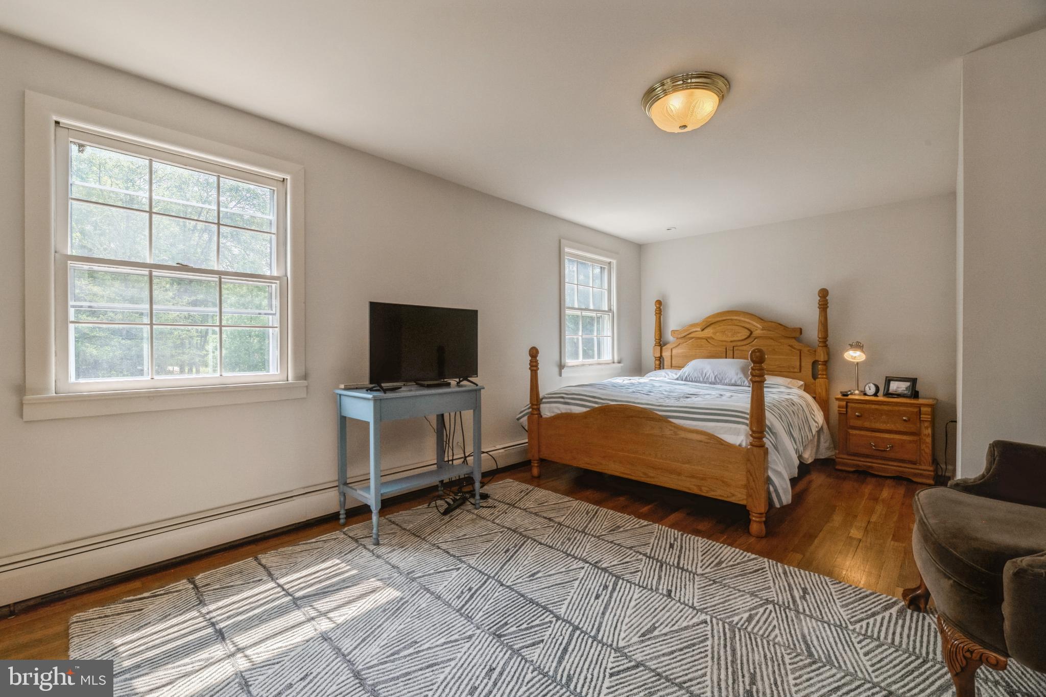 7 Perry Drive Ewing, NJ 08628 - Photo 27 of 39 a bedroom with a bed and a flat screen tv