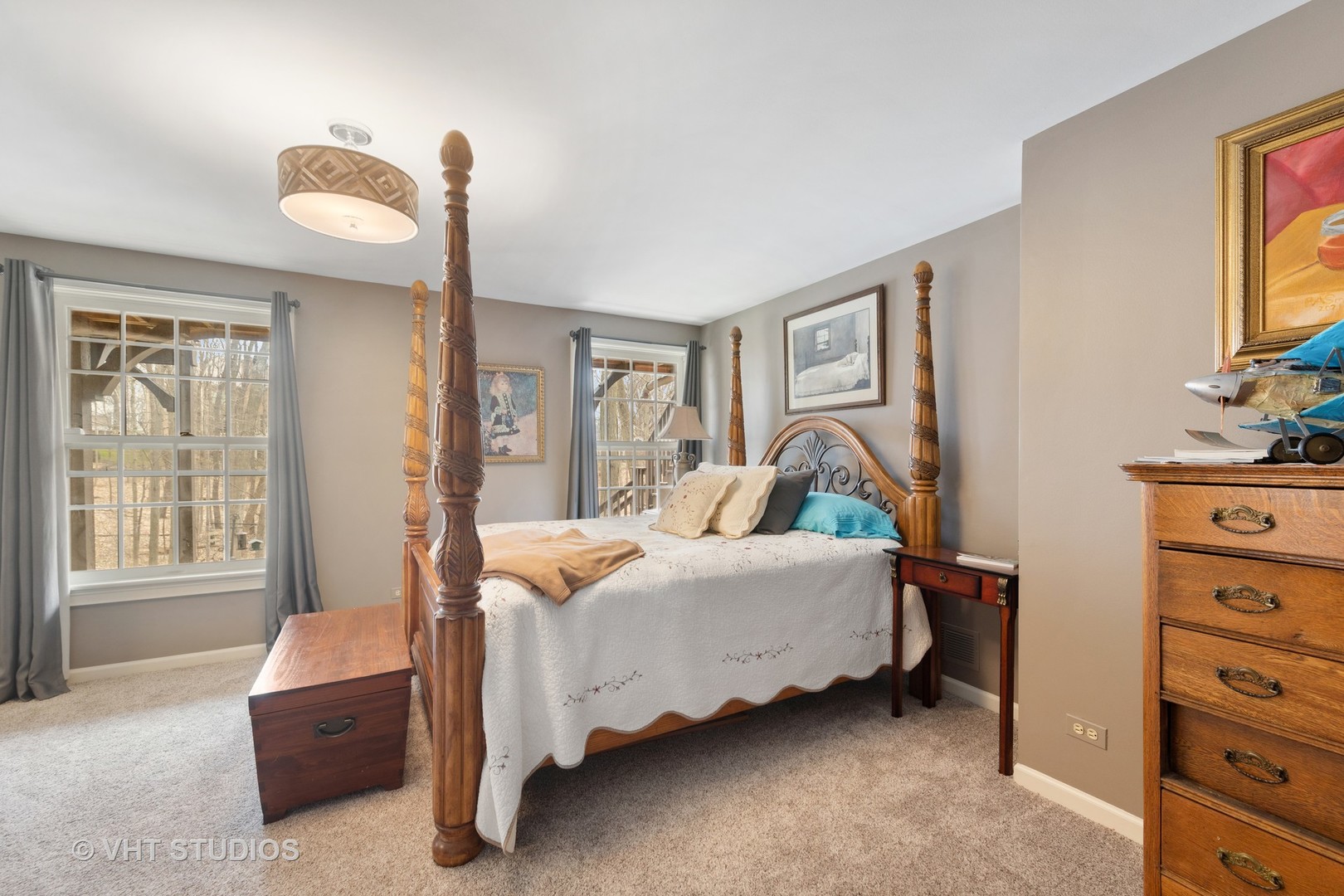 705 Fox Glen Drive St. Charles, IL 60174 - Photo 15 of 49 a bedroom with a bed and a flat tv screen on dresser