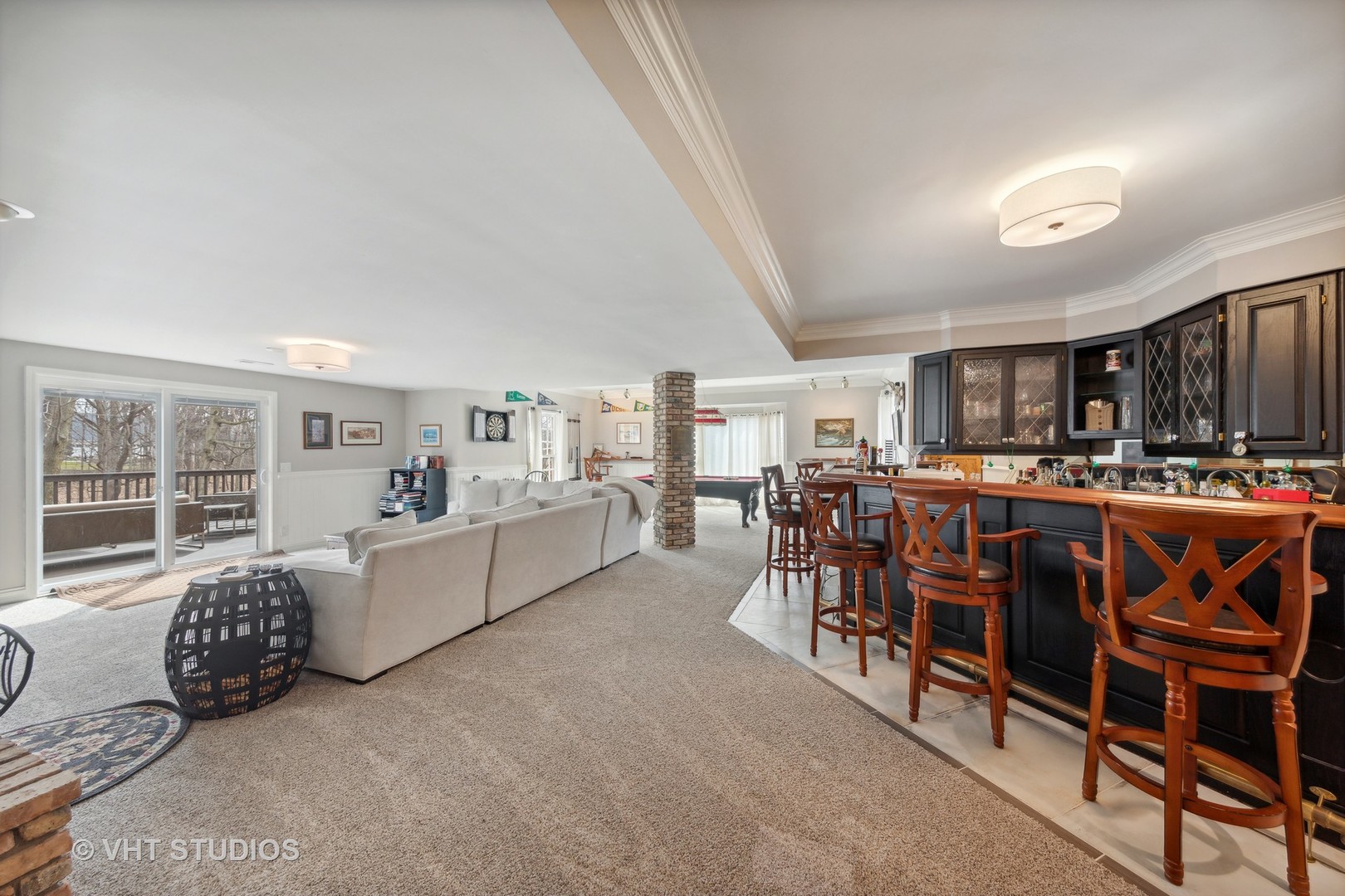 705 Fox Glen Drive St. Charles, IL 60174 - Photo 19 of 49 a living room with furniture and a flat screen tv