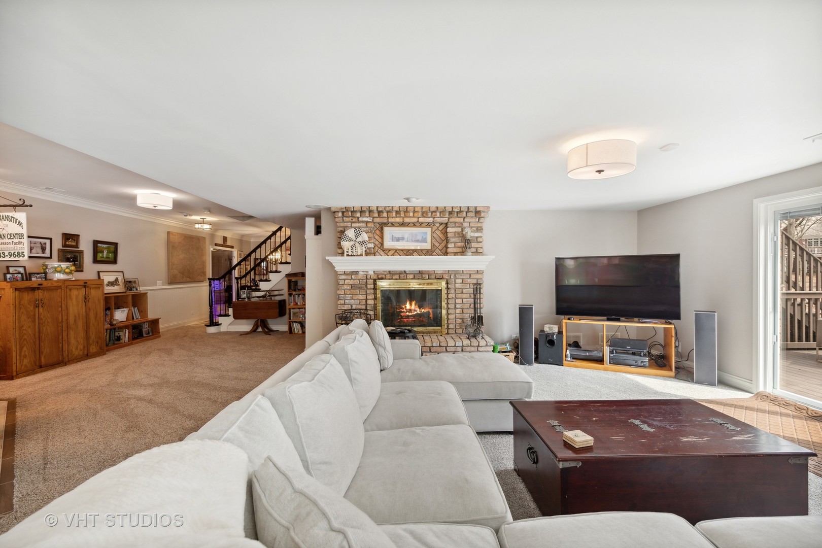 705 Fox Glen Drive St. Charles, IL 60174 - Photo 20 of 49 a living room with furniture and a flat screen tv