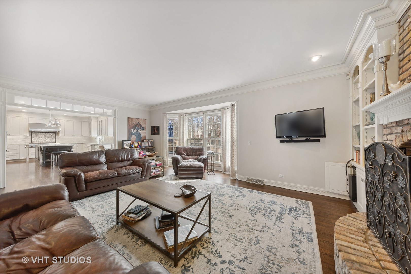 705 Fox Glen Drive St. Charles, IL 60174 - Photo 7 of 49 a living room with furniture and a flat screen tv