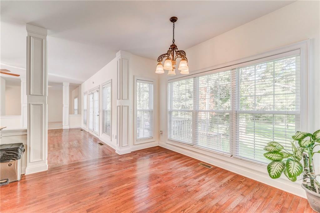 5452 Old Dalton Road Northeast Calhoun, GA 30701 - Photo 16 of 50 a view of an empty room with wooden floor and a window