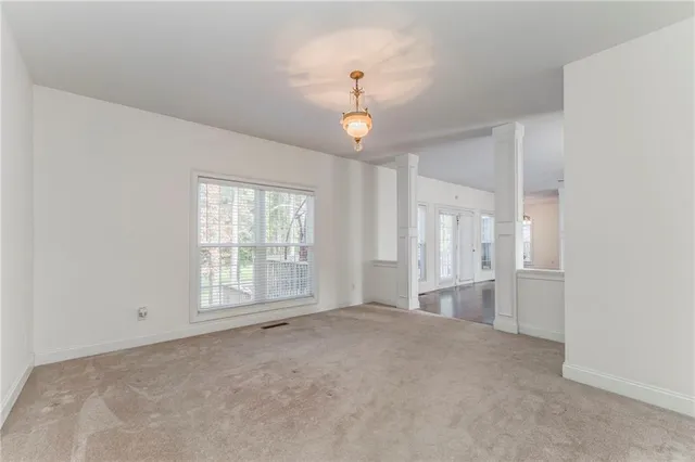 a view of an empty room with a window