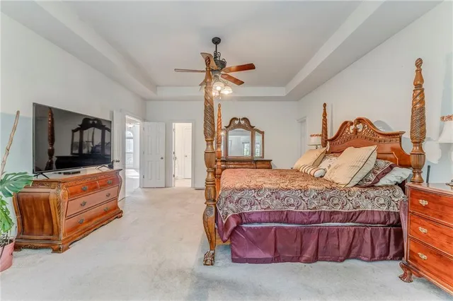 a bedroom with a bed and flat screen tv