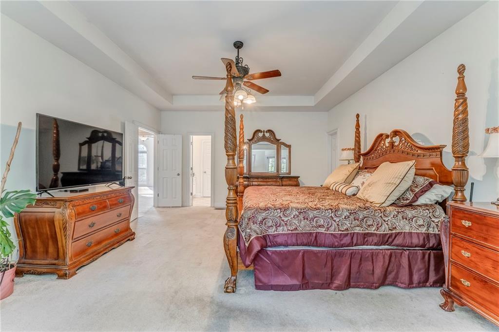 5452 Old Dalton Road Northeast Calhoun, GA 30701 - Photo 25 of 50 a bedroom with a bed and flat screen tv