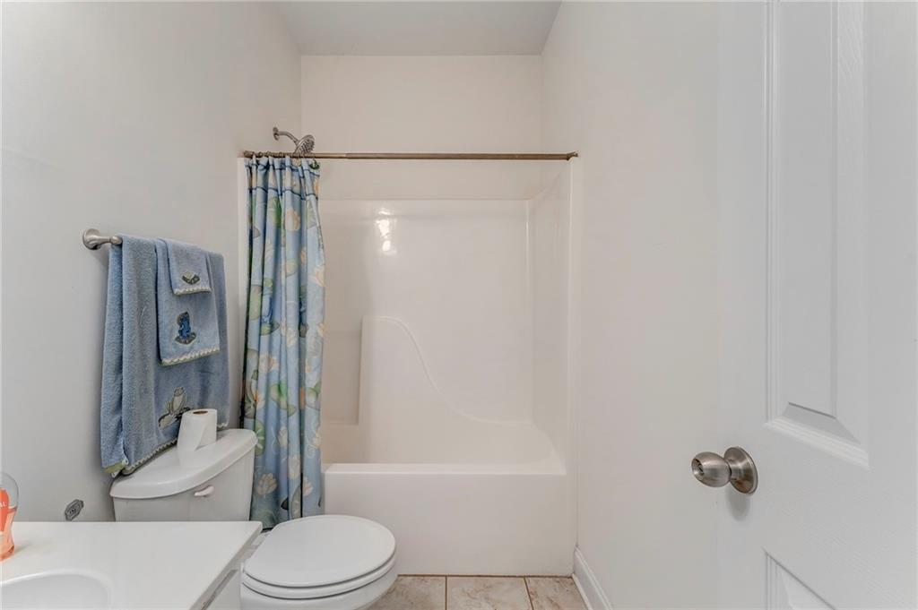 5452 Old Dalton Road Northeast Calhoun, GA 30701 - Photo 33 of 50 a bathroom with a toilet and shower