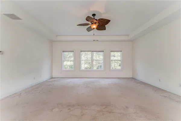 a view of an empty room with a window