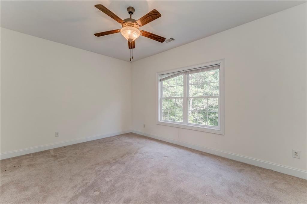 5452 Old Dalton Road Northeast Calhoun, GA 30701 - Photo 36 of 50 an empty room with a window and a fan