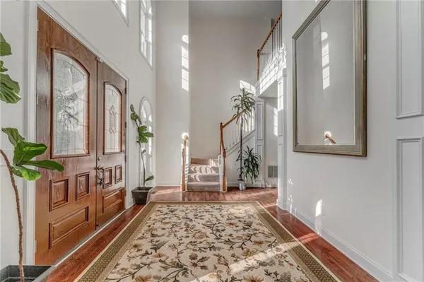 a living room with furniture and a rug