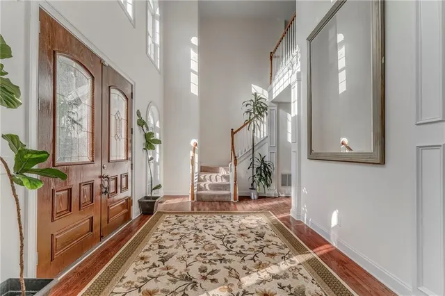 a living room with furniture and a rug