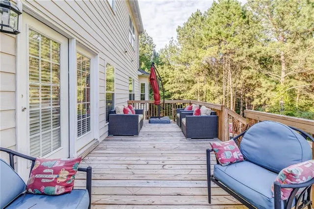 a view of a patio with couches chairs and potted plants