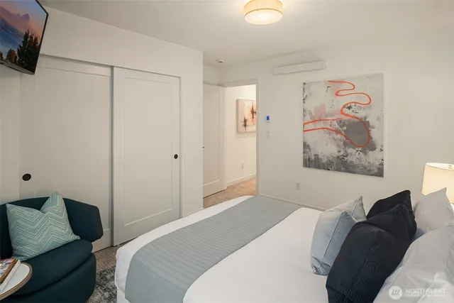 a bedroom with a bed and couch