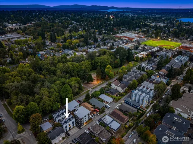 an aerial view of residential houses with outdoor space