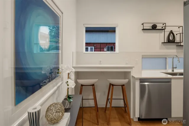 a workspace with furniture and wooden floor